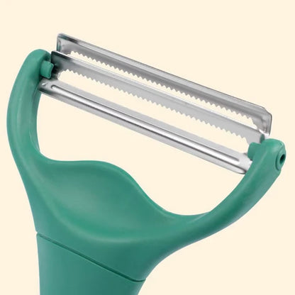 Econome large lame et double tête Deluxe, montrant les lames de proche, sur fond blanc.